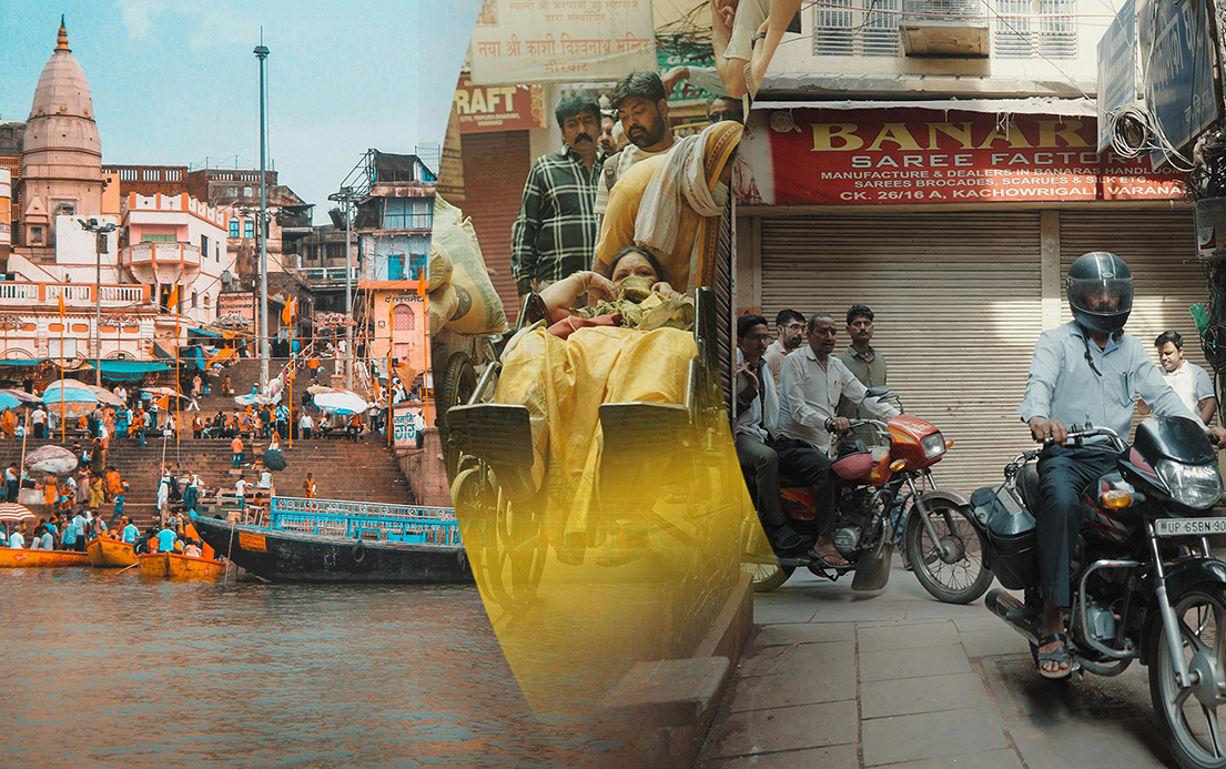 Varanasi waterline, person in wheelchair and people on motorcycles in the street